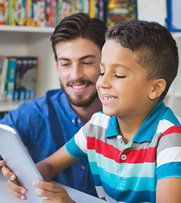 Boy and teacher conferring